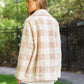 Chic boucle plaid coat for women, featuring side pockets and a lapel neck.
