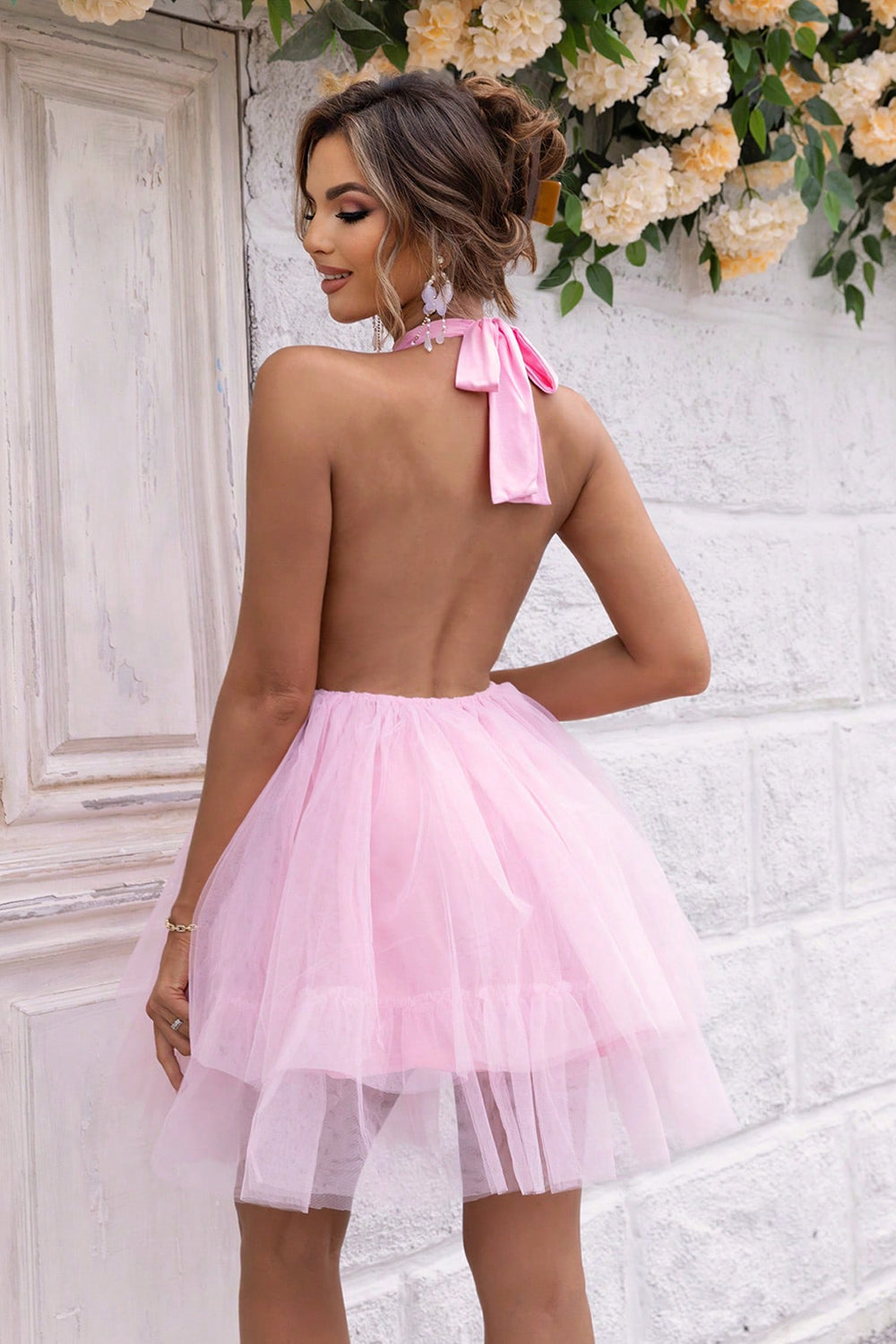 Dazzling halter neck dress with a backless design, available in white, blue, and pink. Perfect for any elegant occasion