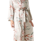 Embrace timeless elegance with our Floral Tie Waist Long Sleeve Robe. Luxurious comfort meets sophisticated style for moments of relaxation and poise.