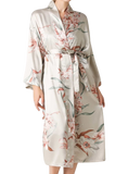 Embrace timeless elegance with our Floral Tie Waist Long Sleeve Robe. Luxurious comfort meets sophisticated style for moments of relaxation and poise.