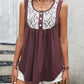 Stylish wine tank top featuring lace and button details.