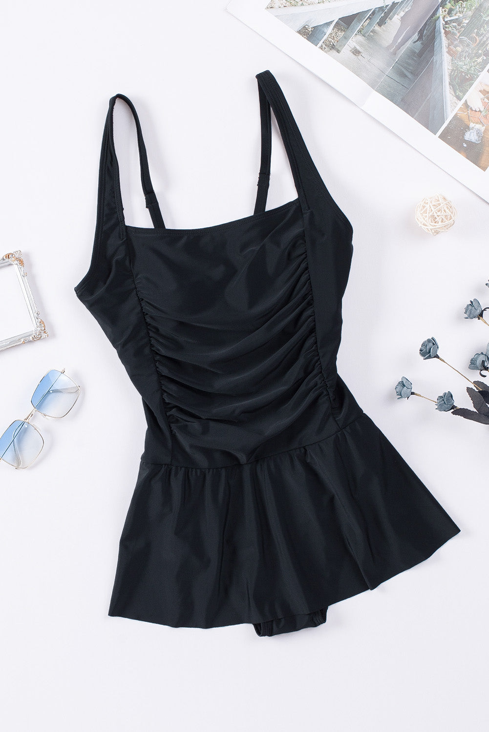 Elevate your beachwear with our chic Ruched One-Piece Swimwear in black and navy blue, offering a flattering fit and elegant design.