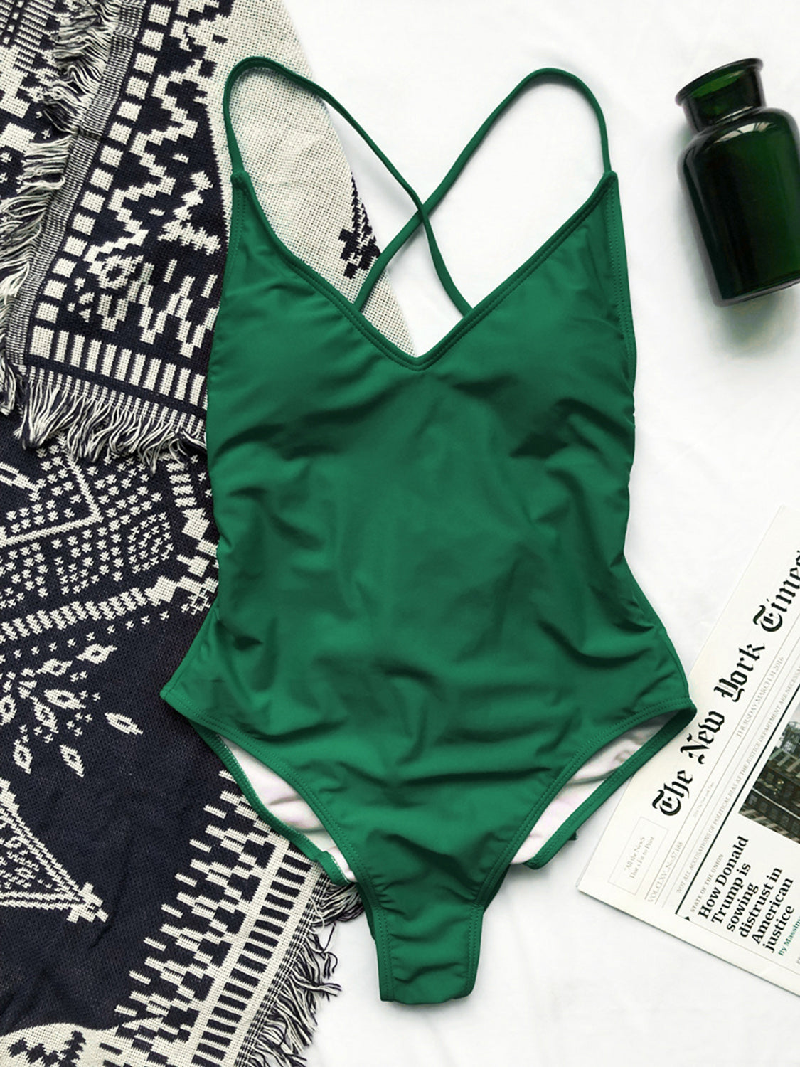 Elevate beach days with our chic kelly green swimwear, featuring a unique crisscross design and customizable lace-up front for a perfect fit.