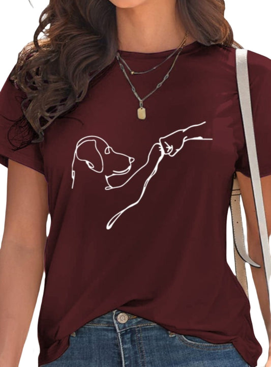 Wine-colored graphic tee with dog and hand illustration.