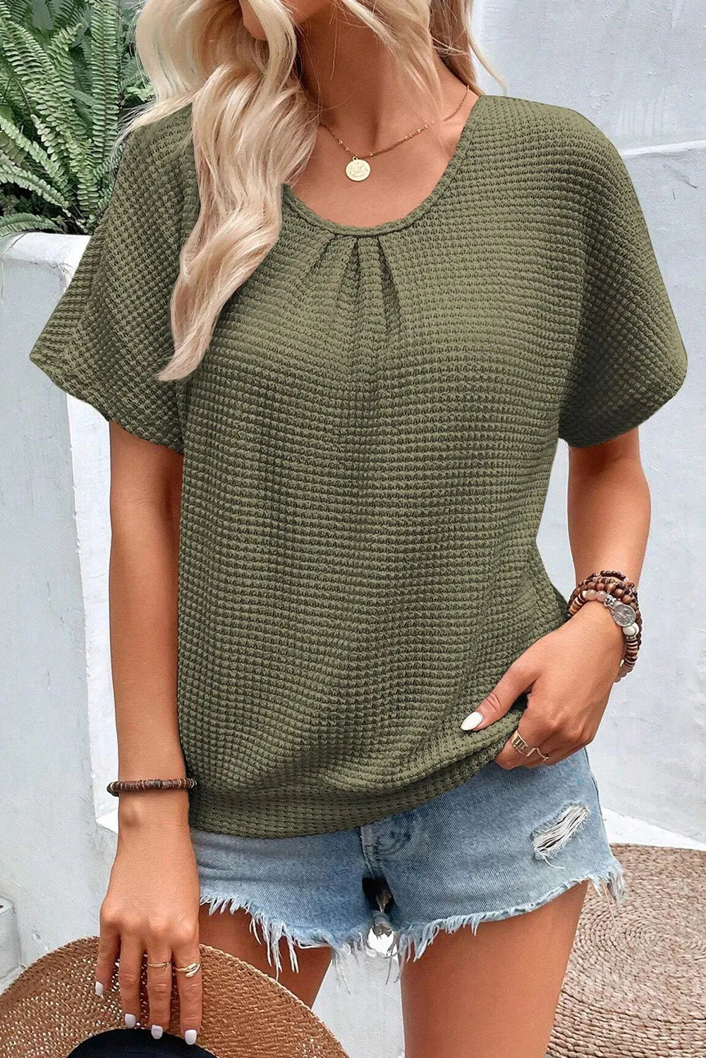 Chic Round Neck Tee with elegant lace back detailing, perfect for versatile, stylish comfort. Ideal for casual or smart-casual looks