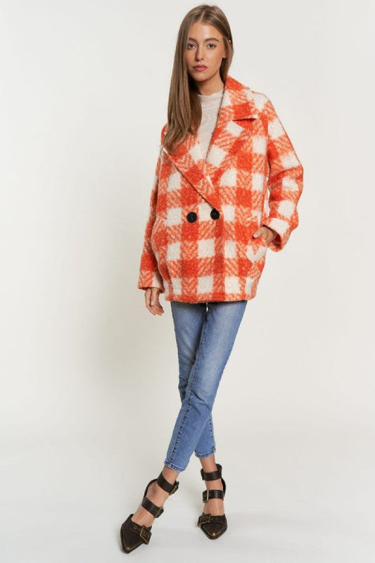 Chic boucle plaid coat for women, featuring side pockets and a lapel neck.
