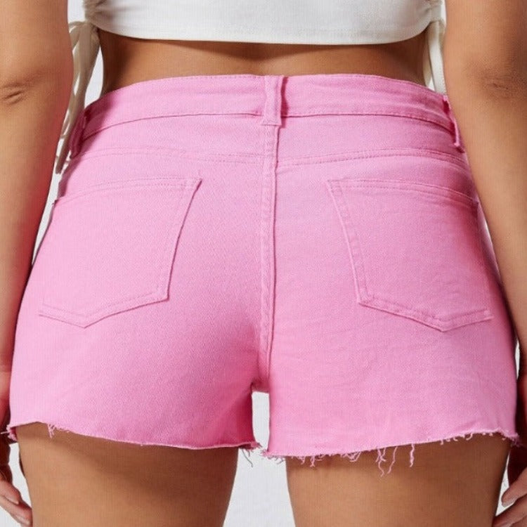 Stay bold in our Pink Distressed Denim Shorts – perfect for adding a pop of color and edgy style to your summer wardrobe!