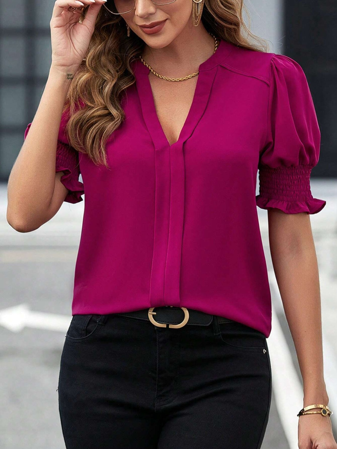 Magenta notched short sleeve blouse featuring ruffled cuffs