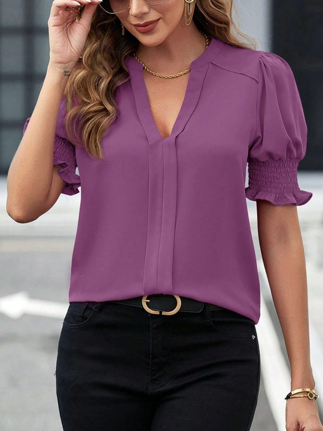 Chic purple blouse with notched neckline and ruffled sleeves