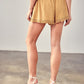 Relaxed fit beige linen shorts with tassel drawstring