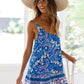 Bohemian floral dress with a mix of blue and pink hues, perfect for a picnic in the park.