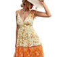 Side view of a woman in a bohemian orange and yellow sundress, perfect for casual summer events.