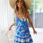 Front view of a bohemian-inspired blue summer dress with a floral design.