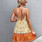 Fashionable bohemian floral print sundress with a flattering fitted waist and flared skirt.