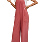 Woman in bohemian style overalls, highlighting the versatile and chic design.