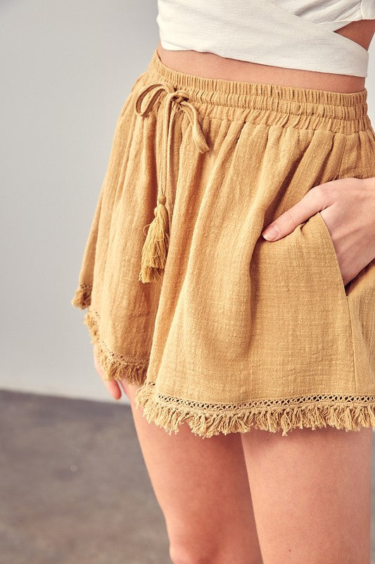 Beige linen shorts with elastic waistband for a snug fit