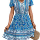 Blue bohemian V-neck dress with floral design, great for a chic and relaxed look.