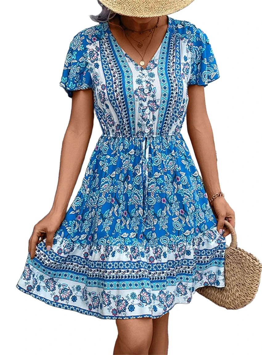 Blue bohemian V-neck dress with floral design, great for a chic and relaxed look.