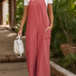 Red bohemian overalls with a wide-leg cut and functional front pockets.