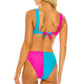 Back view of a woman in a two-piece color block bikini, showing the adjustable tie closure and wide supportive straps.