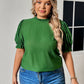 Casual yet chic green blouse perfect for any occasion, paired with jeans