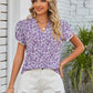 Floral blouse in purple with a chic notched neckline and lace details