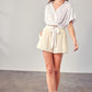 Elegant ivory linen shorts perfect for warm weather