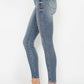 Judy Blue tummy control jeans styled with casual white sneakers.
