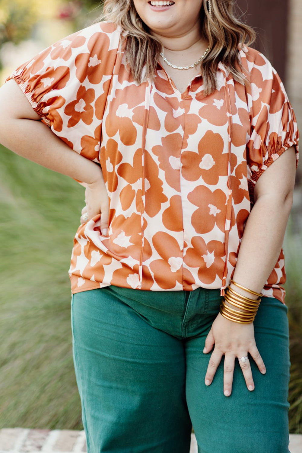 Versatile orange floral print blouse for curvy women