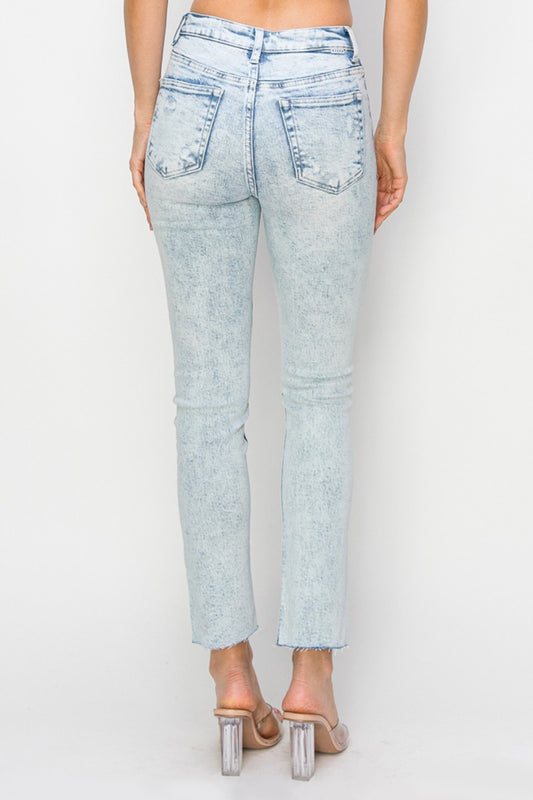 Light-wash distressed skinny jeans with high-rise waist for a modern look
