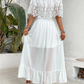 White maxi dress with off the shoulder neckline and lace embellishments