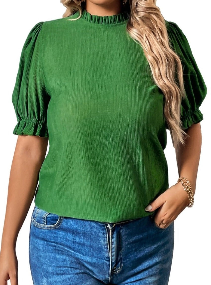 Woman wearing a vibrant green puff sleeve blouse with a flattering fit