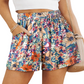 Stylish Floral High Waisted Shorts with pockets perfect for summer. Light fabric, vibrant colors, and versatile design for any occasion.