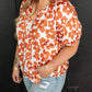 Loose fit floral blouse in vibrant orange and white
