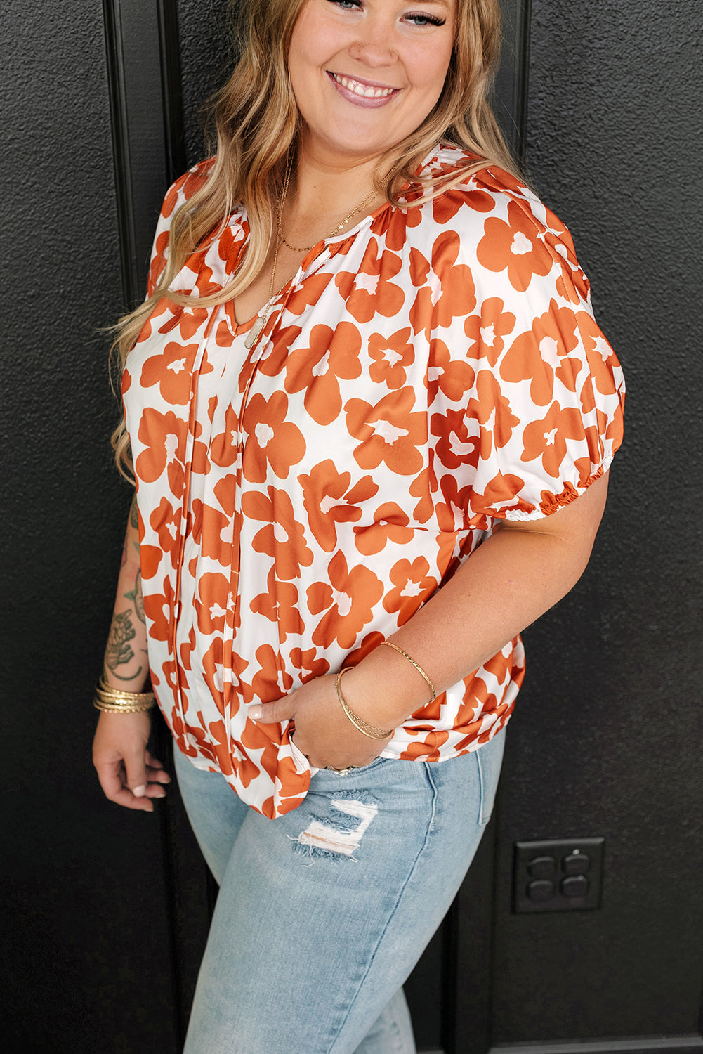 Loose fit floral blouse in vibrant orange and white
