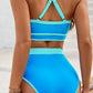 High-waisted blue swimsuit featuring durable, quick-drying fabric and light turquoise accents