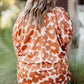 Trendy orange floral blouse for plus size women
