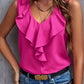 Vibrant pink sleeveless blouse with ruffle accents, adding a pop of color to any outfit