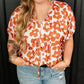 Curvy women's lightweight floral print top in orange and white