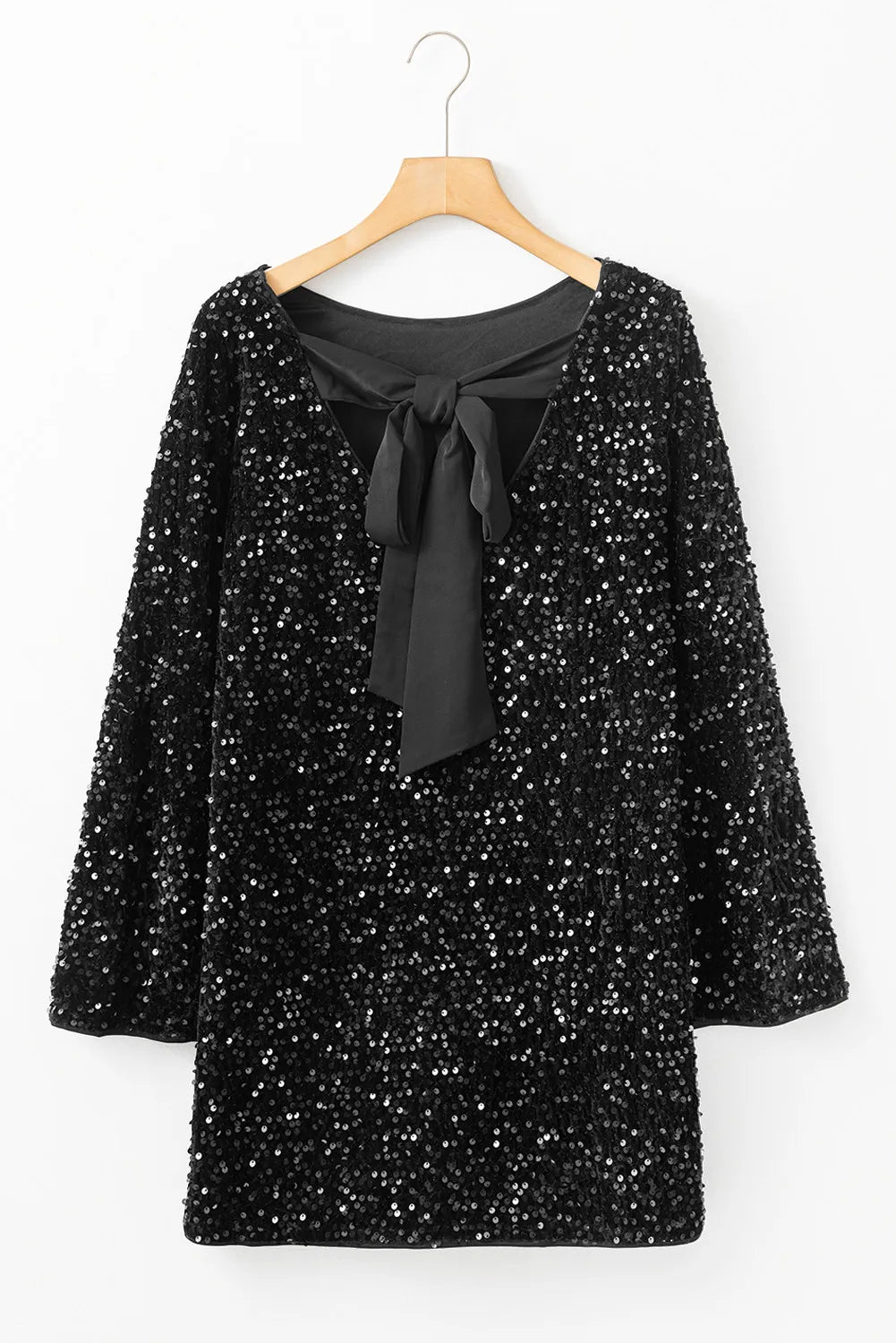 Festive black sequin dress with a bow-back and bell sleeves.