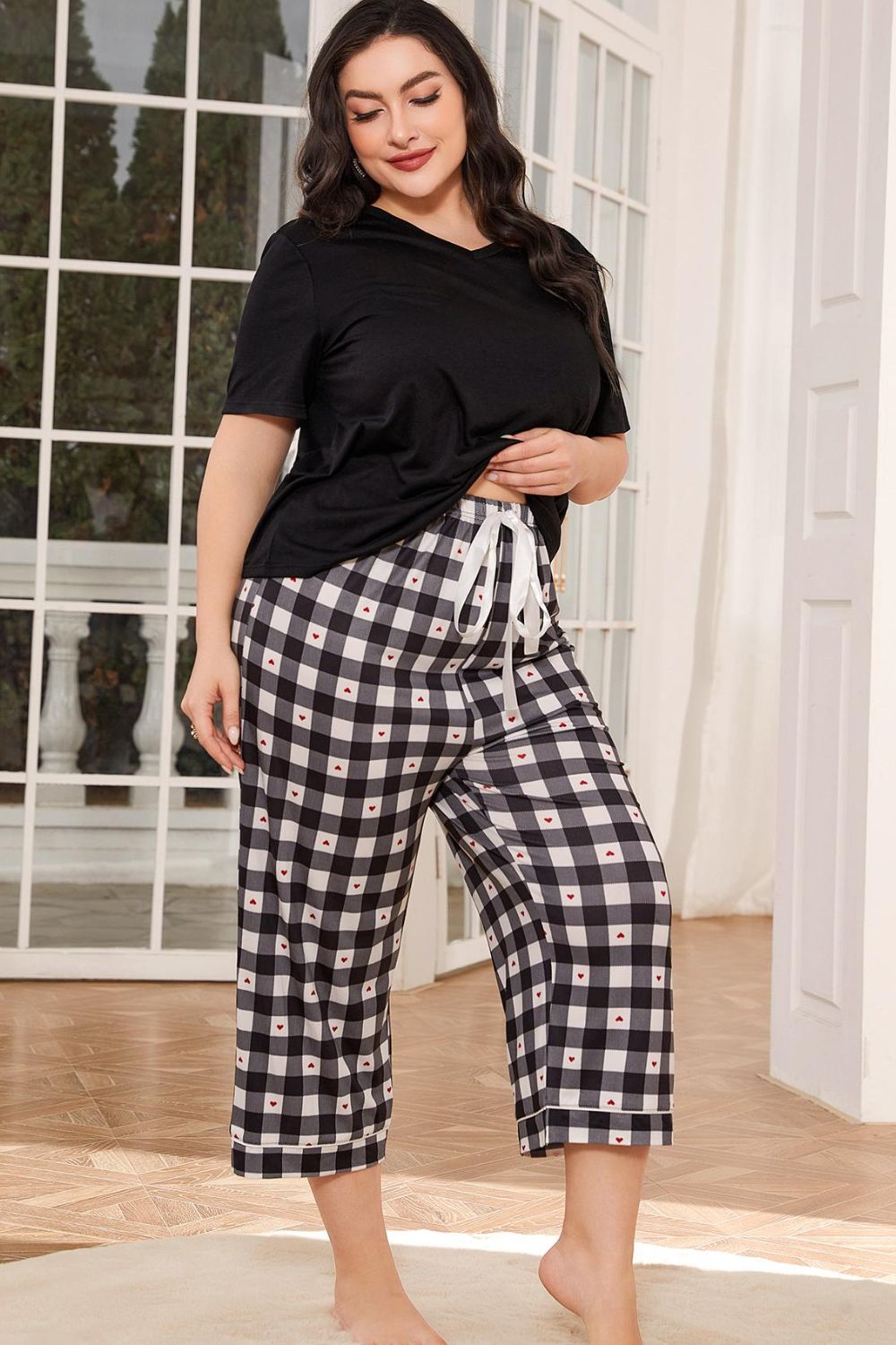 Lounge in style with our V-Neck Tee & Plaid Cropped Pants Set. Perfect blend of comfort and chic for everyday wear