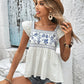 Chic embroidered blouse with a flattering square neck, breezy cap sleeves, and versatile style for any occasion.