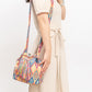 Woven fabric bucket bag with colorful geometric designs.