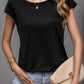 elegant and edgy black and pearl top with cap sleeves