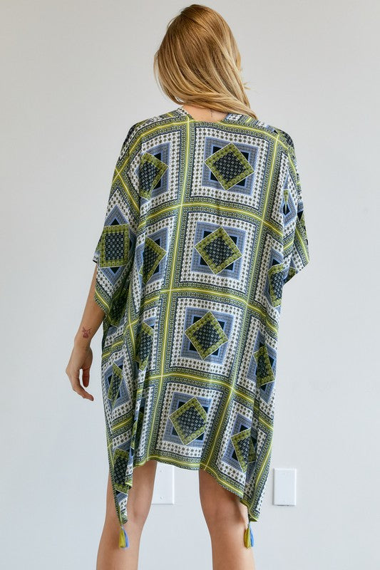 Geometric pattern kimono with tassels in shades of blue and green