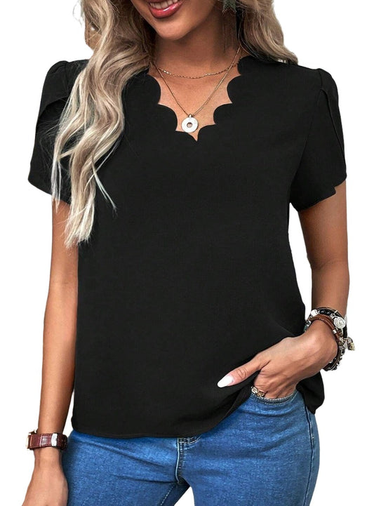 Sophisticated black top with scalloped neckline design