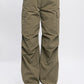 Women’s olive cargo pants featuring drawstring waist, perfect for everyday wear.
