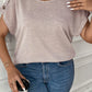 Relaxed fit plus size blouse with unique button accents on the shoulders