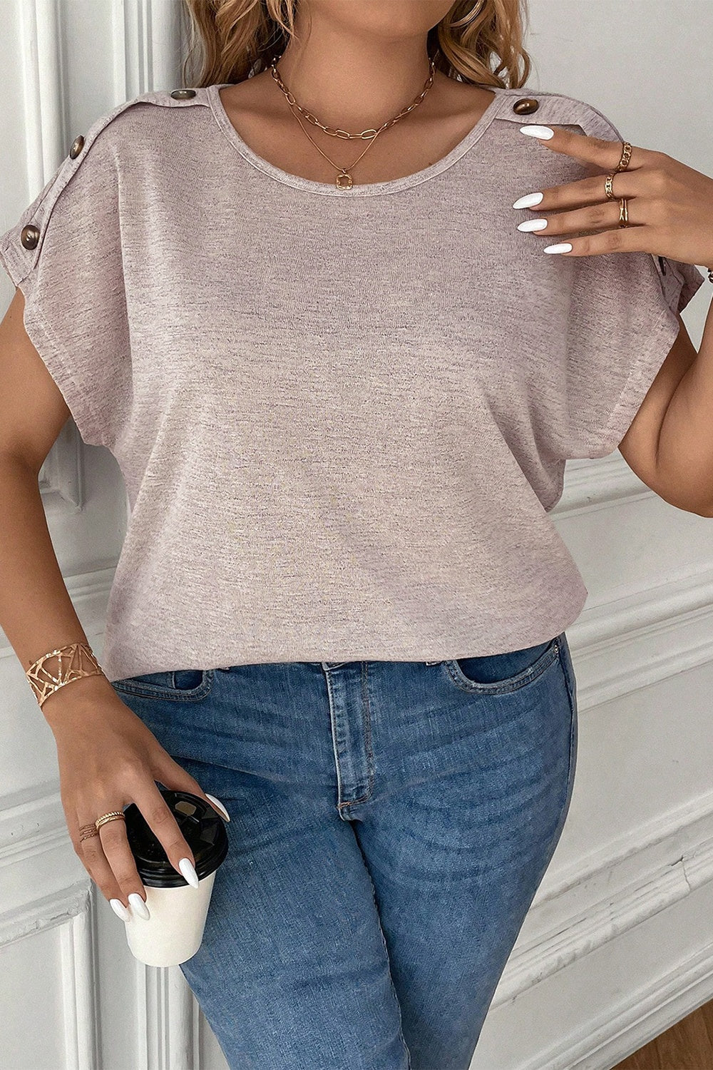 Relaxed fit plus size blouse with unique button accents on the shoulders