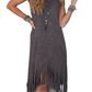 Boho-chic sleeveless midi dress with playful tassels, perfect for versatile day-to-night style. Comfort and elegance in one.